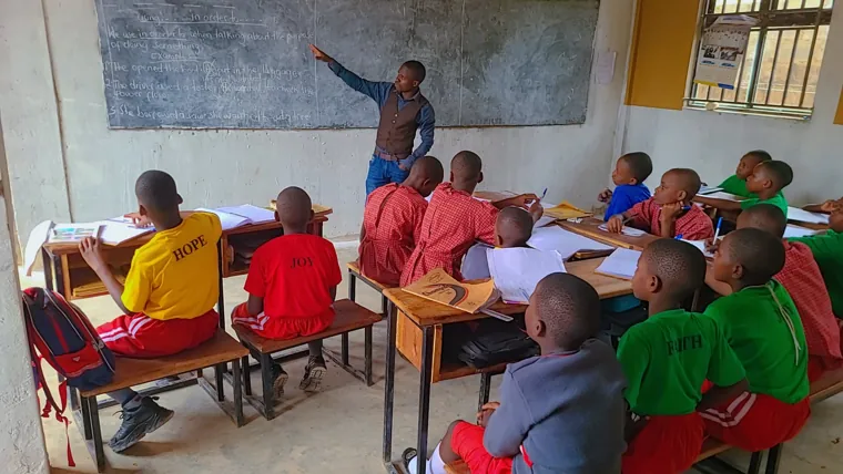 Primary pupils following a lesson at their desks