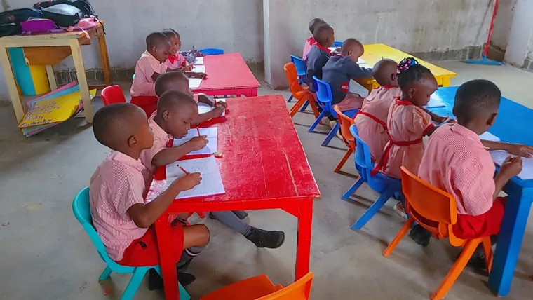 Children working in their exercise books